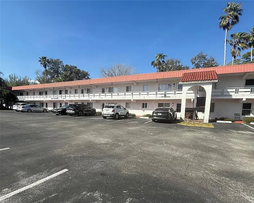 Panoramic view of an Orchid Springs building under blue sky